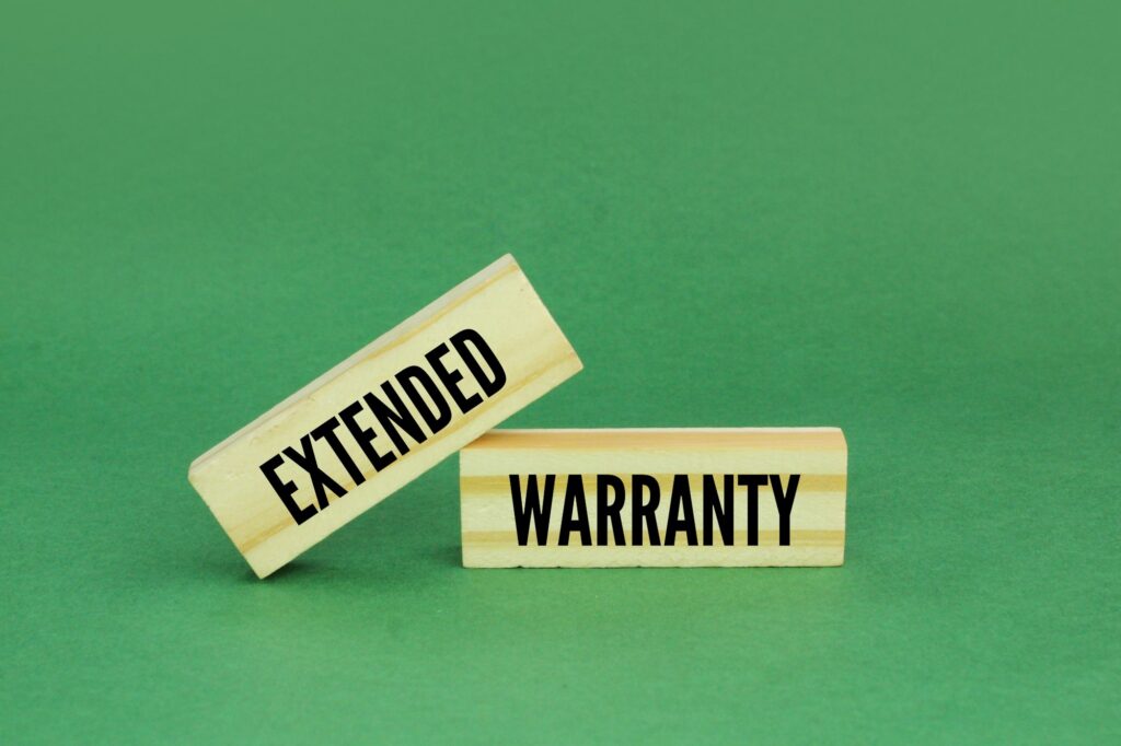 Wood with the word Extended Warranty. Lifetime Mattress Warranty