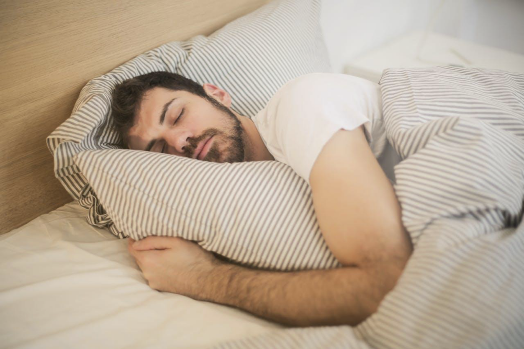 Sleeping peacefully after fixing signs your mattress is hurting your sleep.